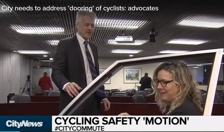 CityNews Toronto video of Dooring crisis that City Council must address. Demonstration of Dutch Reach anti dooring motion done with a car door during Council meeting.